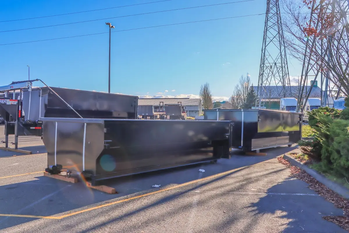 Roll-off dumpster ready for waste disposal at job site for Concrete Dumpster Rental in Algona